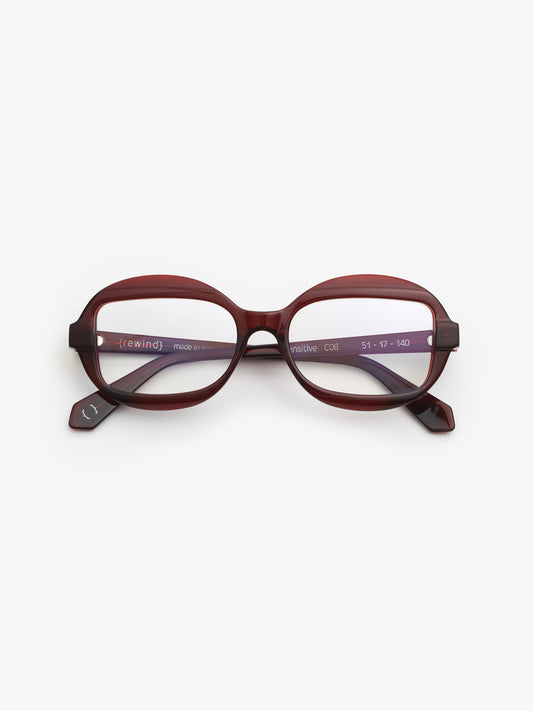 Sensitive unisex eyeglasses by Rewind Eyewear, dark red transparent acetate frame