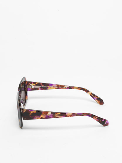 Storytelling women's sunglasses by Rewind Eyewear, dark avana with violets spots acetate frame